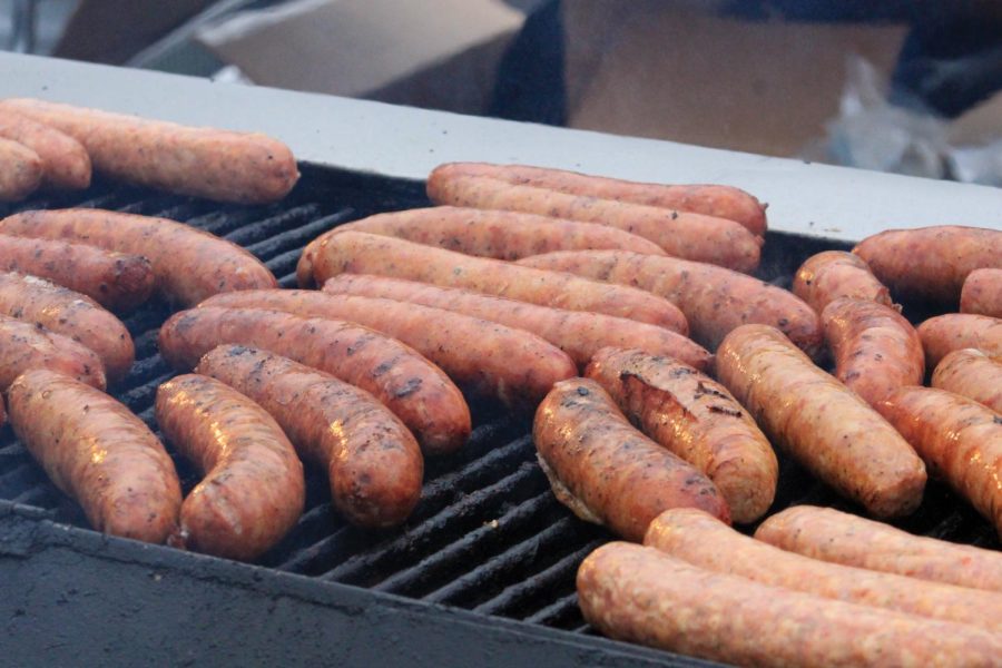 Sizzling on the grill are Chicago Doghouses large alligator sausages paired with its Chicago-style hot dogs.