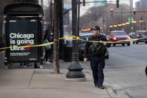 Police investigate a shooting near the 1200 block of South Michigan Avenue on March 14. 