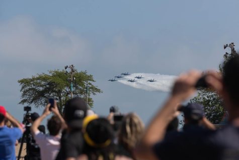 Soaring high above the sky, the US Navy Blue Angels roar over Chicago again