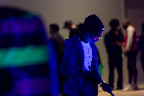 Black lights illuminate the event space creating vivid and bold colors on clothing at the first-time-ever event.