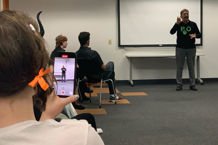 ASL Tutor and Interpreter Peter Wujcik signs stories for the "Ghost Stories & Costume Party."