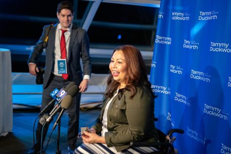 Duckworth begins to answer questions from reporters on her victory after being elected to serve a second term in the U.S. Senate. 