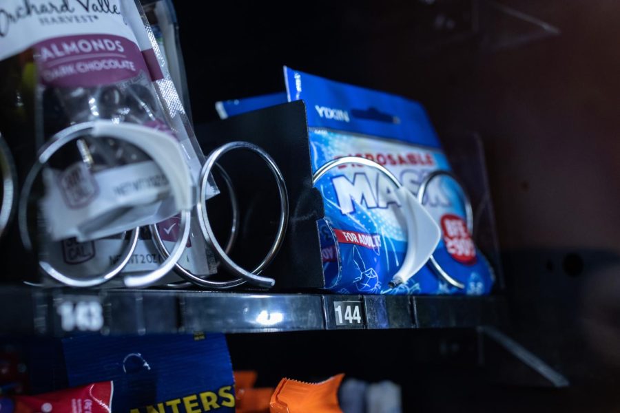 Located in all campus buildings, individual masks can be purchased in the vending machines for $2.50. The machines are restocked weekly. However, technical difficulties may occur.