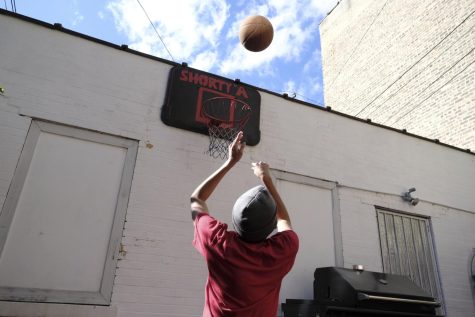 Abad Viquez shoots a basketball at his backyard court in North Park on Oct. 7, 2022. When Viquez was younger and learning how to play basketball, others would say he wouldn’t be able to, something Viquez was determined to prove wrong. “I just want to remind people with disabilities that your disability doesnt find you like, anythings possible at the end of the day,” Viquez said.