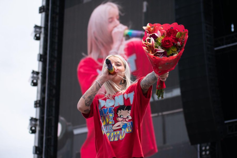 Young Miko holds the bouquet of roses that a fan from the crowd gave her in Grant Park at the Sueños Music Festival on May 28, 2023. 