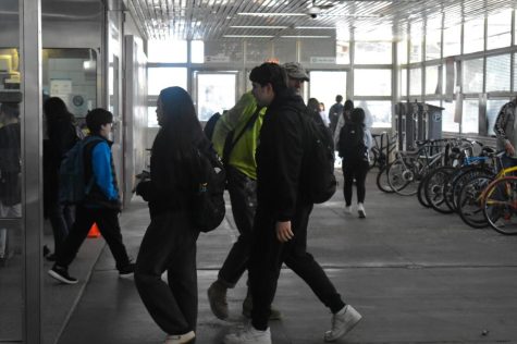 Students walk into the Pulaski CTA orange line station, located at 5106 S. Pulaski Rd., on Friday, May 5, 2023, to scan their Ventra cards. At Columbia, students can opt into the college’s Ventra card program, which gives unlimited swipes for the semester, for a fee. 