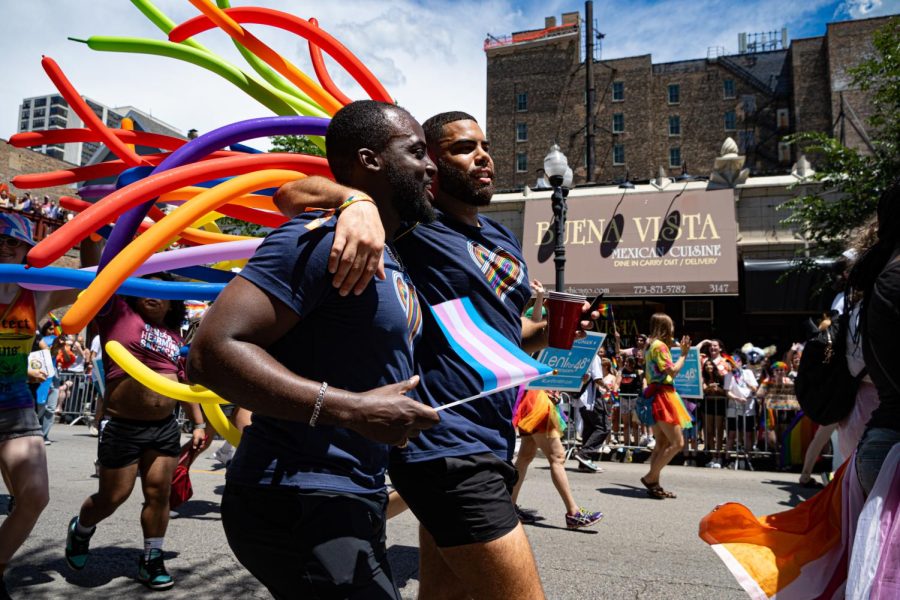 A couple embraces each other while walking down Broadway Street during the Chicago Pride Parade on Sunday, June 25, 2023. Founded in 1970, this is the 52nd annual Chicago Pride Parade.