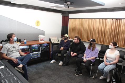 Students sit with their professor in the class Multitrack Music Recording II held in the basement floor of 33 E Ida B Wells Dr. It is one of the in-person courses offered at Columbia this summer semester.