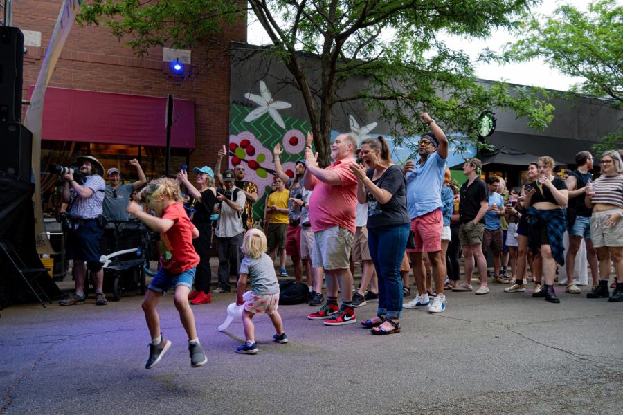 People of all ages jump and cheer during a performance by Justice Hill & Nightime Love at Midsommarfest in Andersonville on Saturday, June 10, 2023. Located at 5200 N. Clark St, Justice Hill & Nightime Love was one of 7 bands to play at this events Center Stage on Saturday.