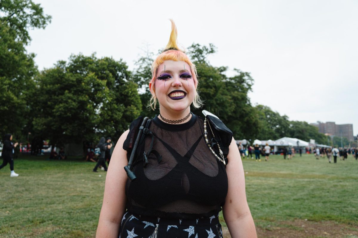 Festival-goer Chris Riddle poses for a portrait in Douglass Park at Riot Fest on Saturday, Sept. 16, 2023. Riddles fourth year at the festival, she travelled from St. Louis to enjoy the music.