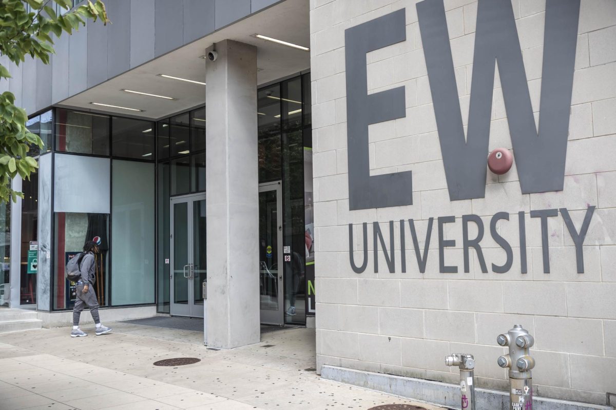 A person walks into the East West University on-campus Flats building, located at 829 S. Wabash Ave., on Wednesday, Sept. 6, 2023.