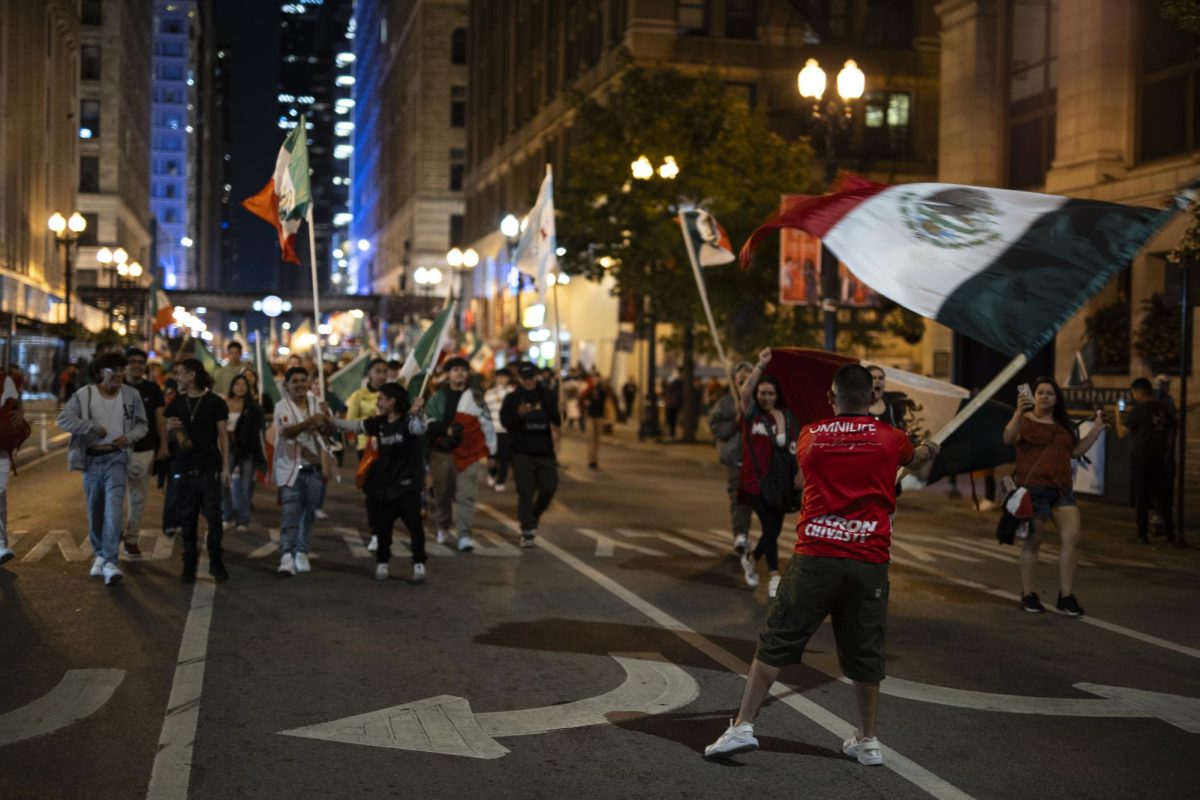 Participants of the Mexican Independence Day celebrations march on East Washington Street, towards Michigan Avenue, on Saturday, Sept. 16, 2023.