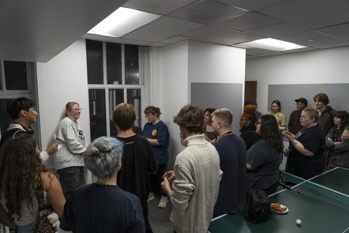 Students gather to hear the results of a raffle held at the grand opening of the photo lounge on the 12th floor of 600 S Michigan Ave. on Oct. 5, 2023.