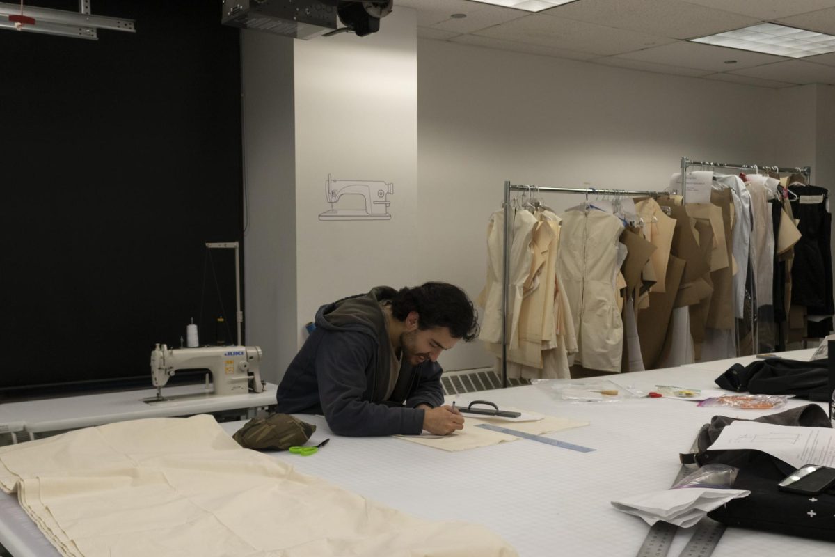 Junior fashion product development major Jair Reyes works on a course assignment at the Wabash Campus Building Fashion Lab, 623 South Wabash Ave., on the 7th Floor. on Oct. 5, 2023. Open studio access is available to all students in the School of Fine and Performing Arts.