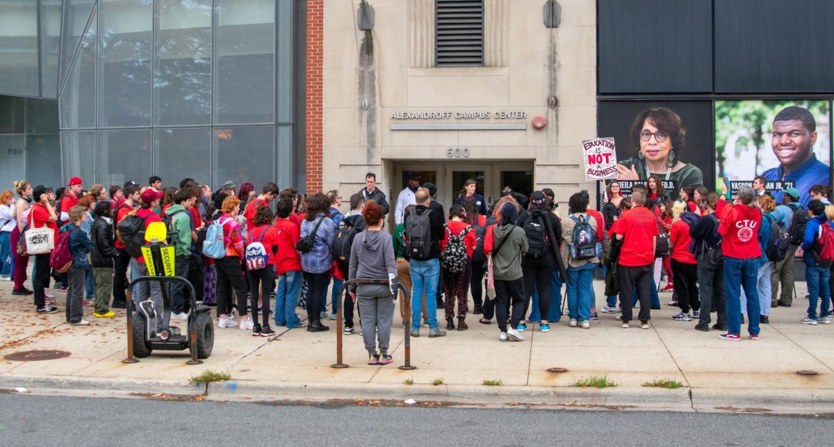On Thursday, Oct. 26, 2023, students and faculty rallied outside 600 S. Michigan in support of the part-time faculty union. Many people are wearing red and holding signs to show support for the upcoming strike starting Monday, Oct. 30.
