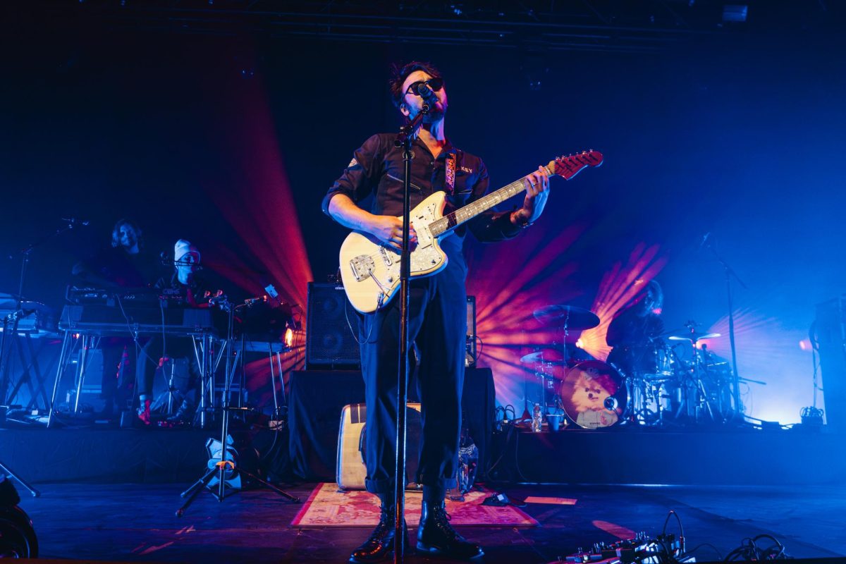 Shakey Graves strums along while performing “The Perfect Parts” at the Salt Shed on Friday, Nov. 17, 2023. Feeling comedic, Graves announced he was going to play a slow song but then played a lively guitar heavy song and jumped around.