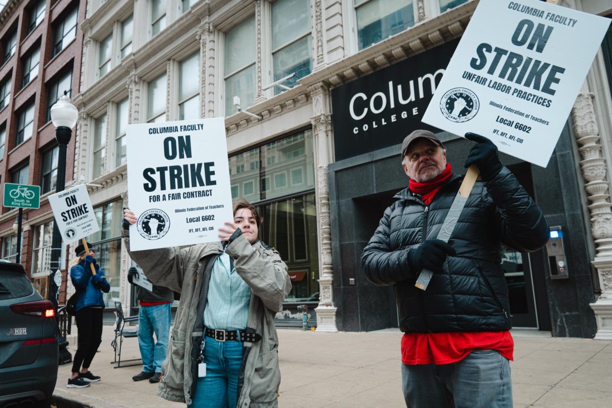 David Moravec, cinema and television arts adjunct professor, and Wyatt Fritts comedy writing and performance major stand with the picket line outside of 1104 S. Wabash on Tuesday, Nov. 7, 2023. Students and faculty continue to show support for CFAC leading into week two of the strike.