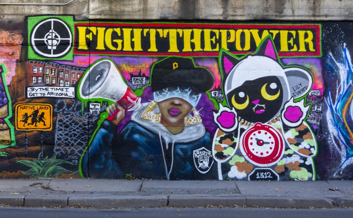 Stephanie Garland has an art piece titled Fight the Power on Commercial & 93rd Street. The art piece is in a viaduct surrounded by many other works of graffiti/art.