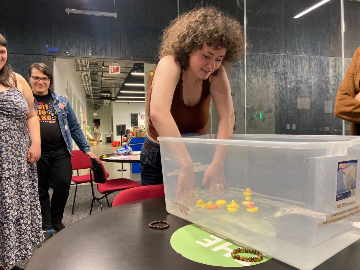 A Julez Rhein, a senator for SGA, engages in one of the duck races at the Student Government Association event on Friday, Nov. 9. The event was to help raise awareness for disability advocacy. 