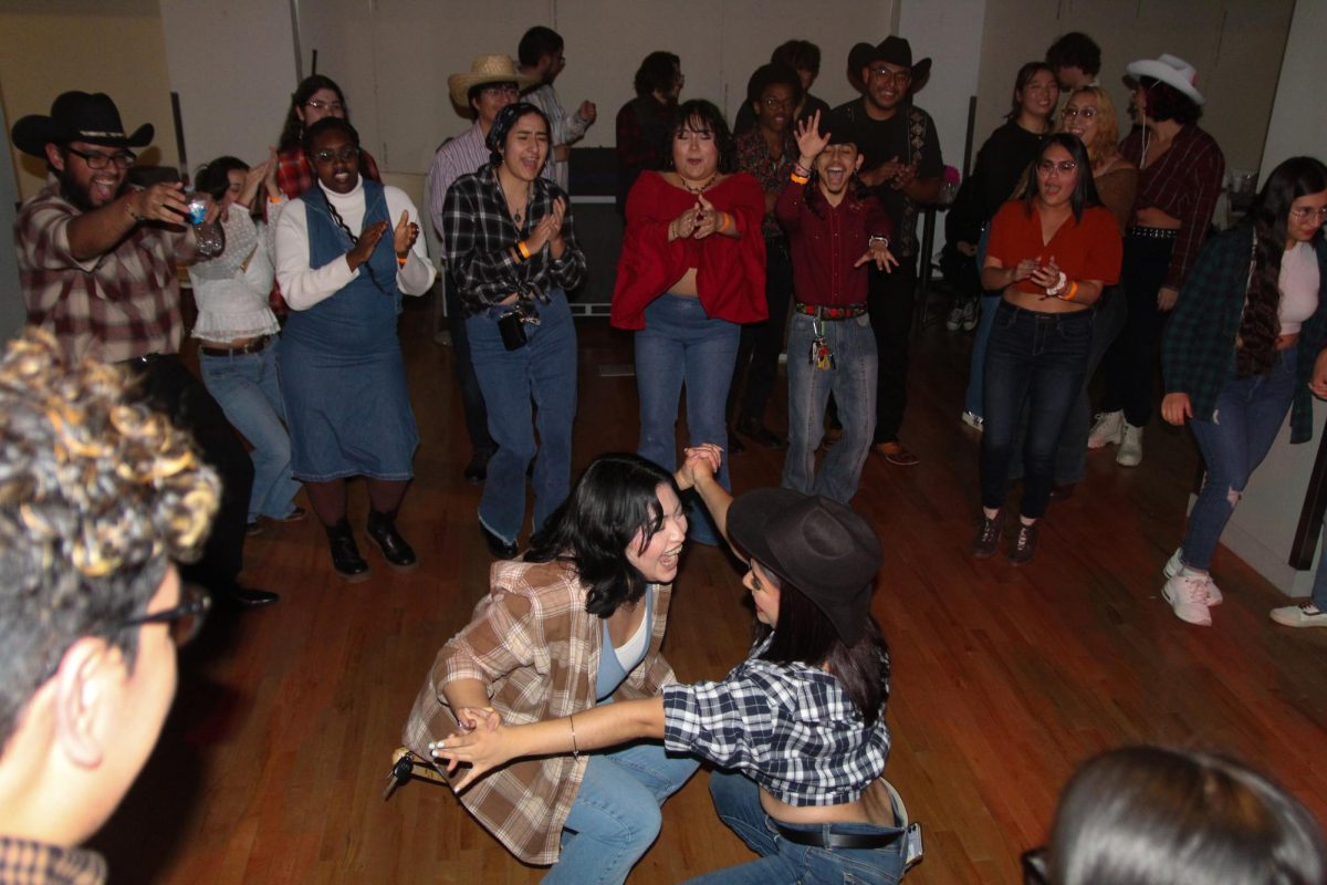 Students dance at the second annual Noche Buena, held at the 1104 S Wabash Ave. building on Friday, Nov. 10, 2023