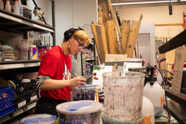 River Wise, a junior Theatre Technology and Design major creates a paint guide for an upcoming show. Wise is working in The Shop located on the first floor of the Theatre buidling at 72 E 11th St.