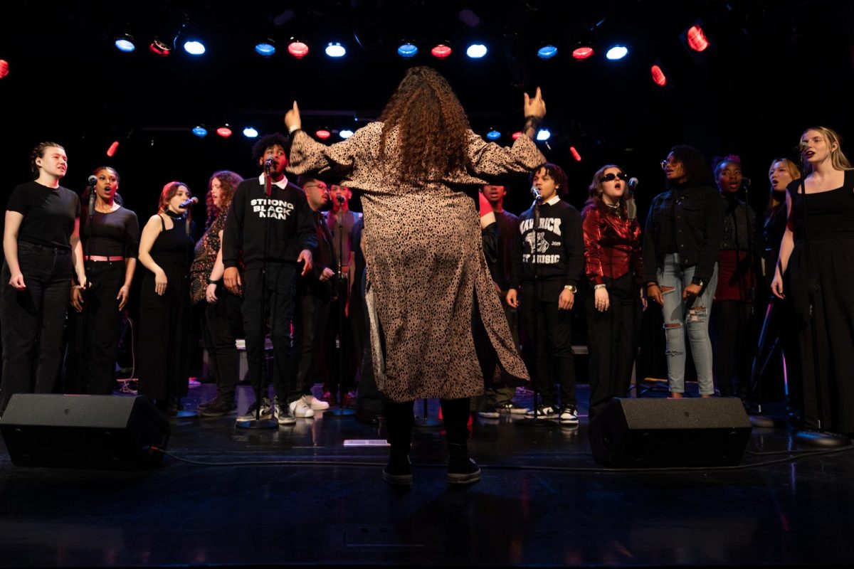 Assistant+professor+of+instruction+in+the+Music+Department+Cassandra+ONeal+leads+the+gospel+choir%2C+composed+of+several+vocalists%2C+during+their+midterm+performance+on+Wednesday%2C+March+13%2C+2024.+The+students+chose+most+of+the+music+and+shared+the+time+with+the+Hip+Hop+ensemble+in+the+Concert+Hall+of+1014+S.+Michigan+Ave.