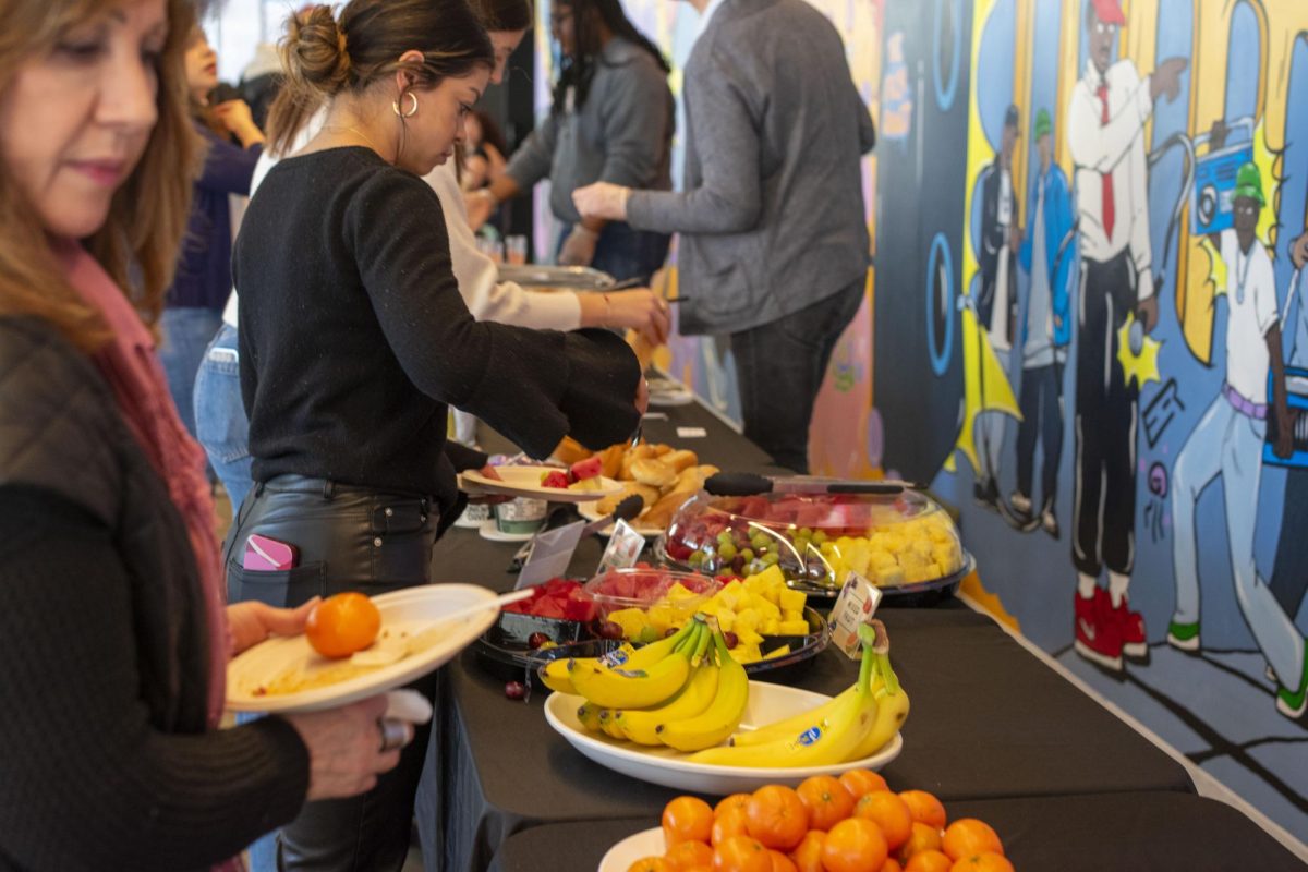 Students+and+faculty+eat+an+array+of+brunch+foods+and+drinks+being+served+at+the+Uplift+Kickoff+Brunch+on+Monday%2C+March+11%2C+2024%2C+at+the+Student+Center.+