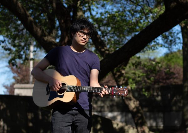 Indie Singer-Songwriter Ian Jake Robleza poses in Grant Park on Wednesday, May 1, 2024. Robleza currentlly studies Audio Arts and Acoustics at Columbia College Chicago with a graduation set in December.