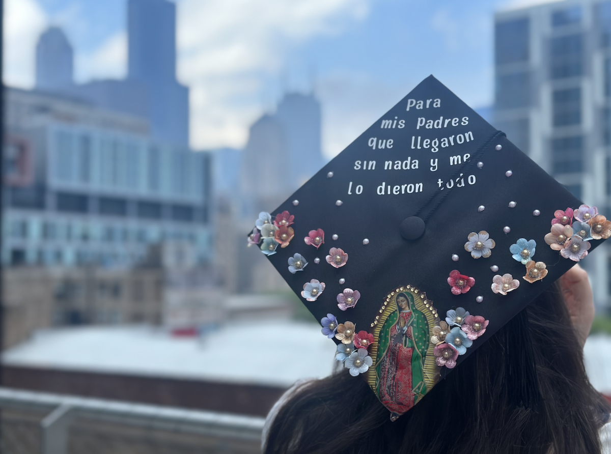 Alexia Tamayo, holding her decorated cap, at the Student Center on Tuesday, May 7, 2024
