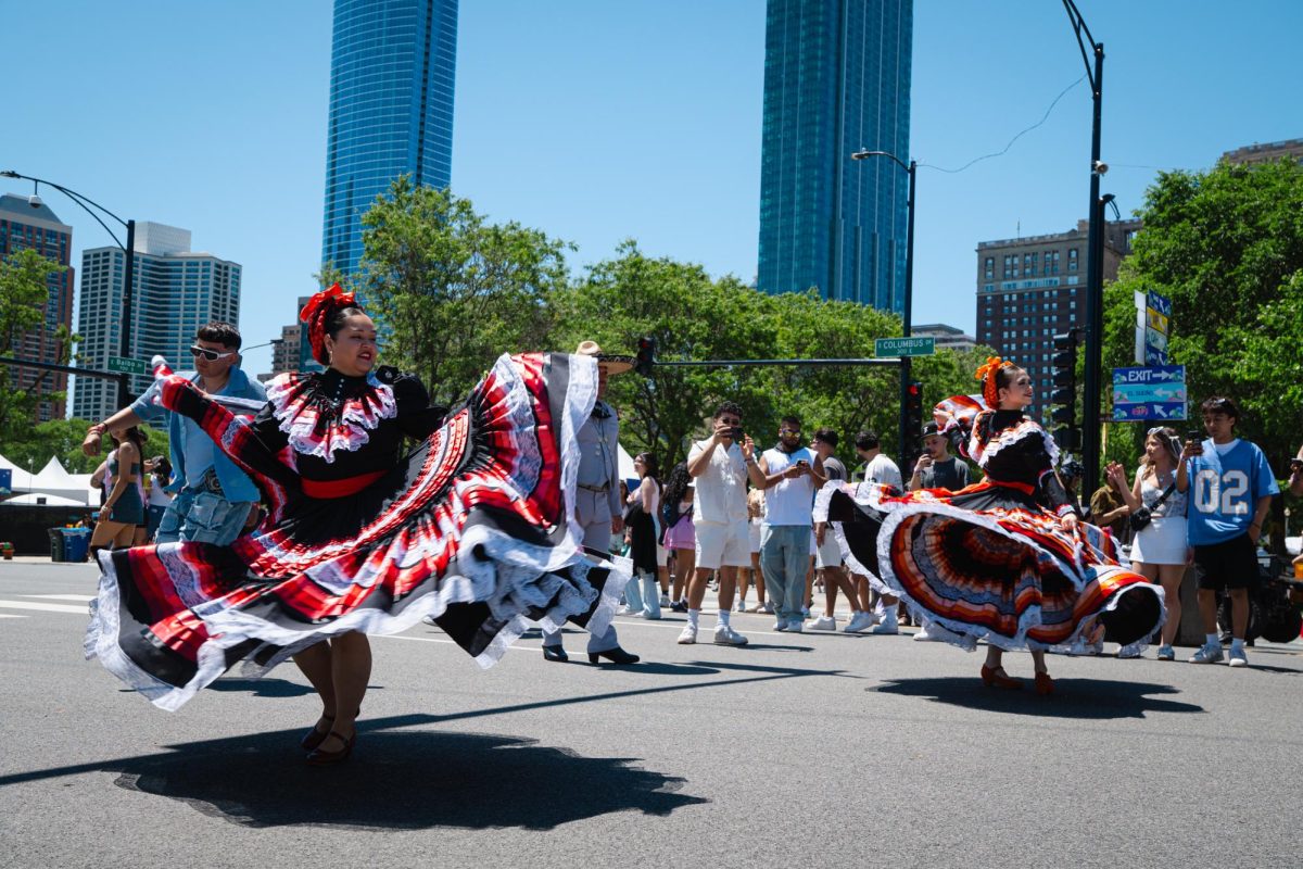 Ballet Folklórico de Chicago, a Mexican folkdancing organization, performs in the street at Sueños festival in Grant Park on Saturday, May 25, 2024. Founded in 2018, the company hosts dance classes for all ages.