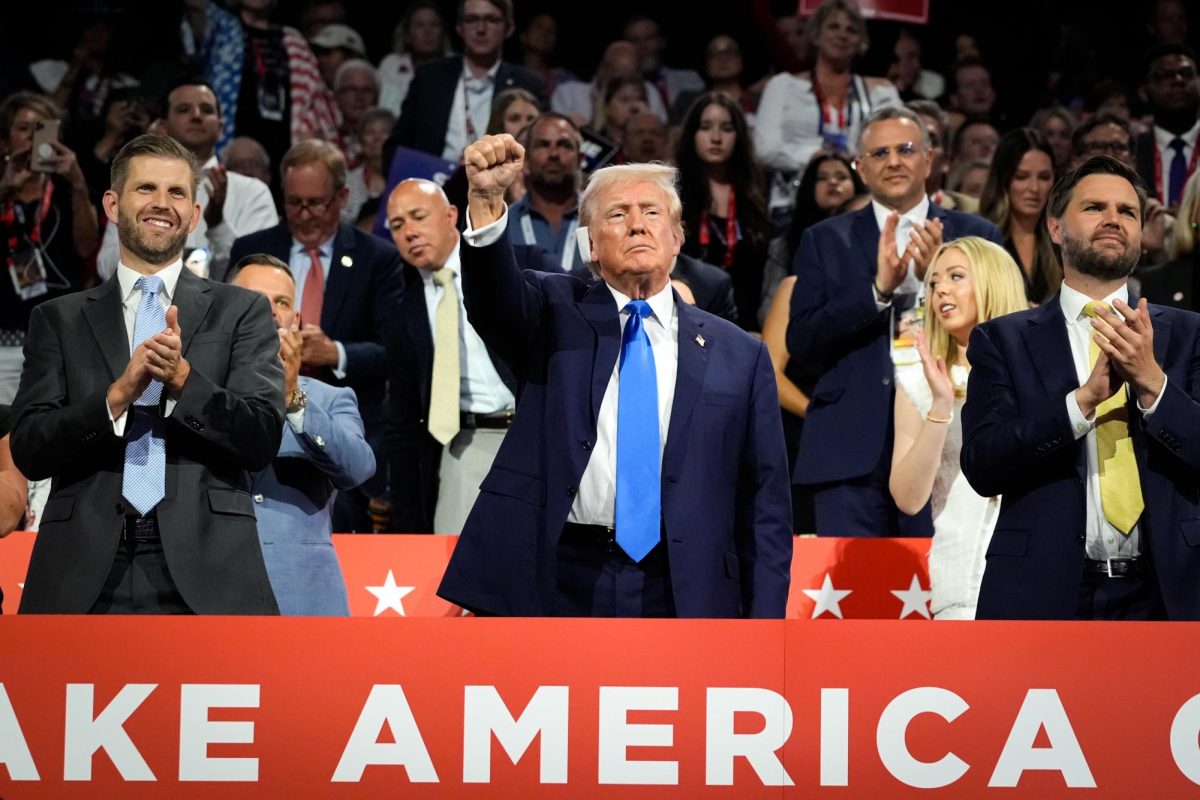 Donald J. Trump raises his fist in solidarity as attendees in the Fiserv Forum Arena cheer at the Republican National Convention in Milwaukee, Wisconsin on Tuesday, July 18, 2024. As the official nominee for the Republican party, Donald J. Trump is presumed to run against Kamala Harris, who current U.S. president Joe Biden endorses.