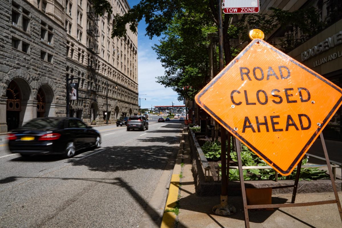 A road closure street sign sits on the sidewalk along East Ida B. Wells Drive in the South Loop in Chicago on Monday, July 1, 2024. The sign marks the closure of East Ida B. Wells Drive and East Congress Plaza Drive, due to the NASCAR street race event taking place July 6 and 7. 