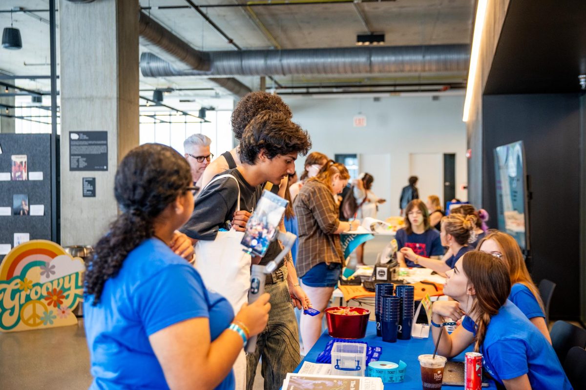 Columbia Chronicle staff speak to students at New Student Convocation at the Student Center on Aug. 30, 2024.