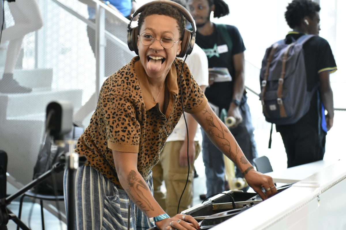 Monet Lewis, a DJ at Columbia, poses for a photo on the second floor of the student center on Friday, Aug. 30, 2024. Lewis mixes near the entrance of the Student Center as a welcoming to the new students attending Convocation.