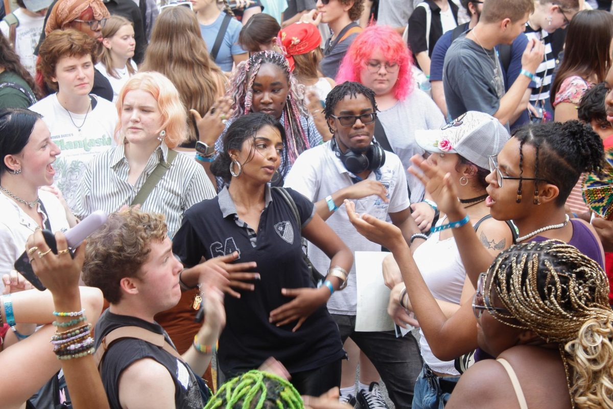 Students dance in the Student Center parking lot at New Student Convocation on Friday, Aug. 30, 2024.