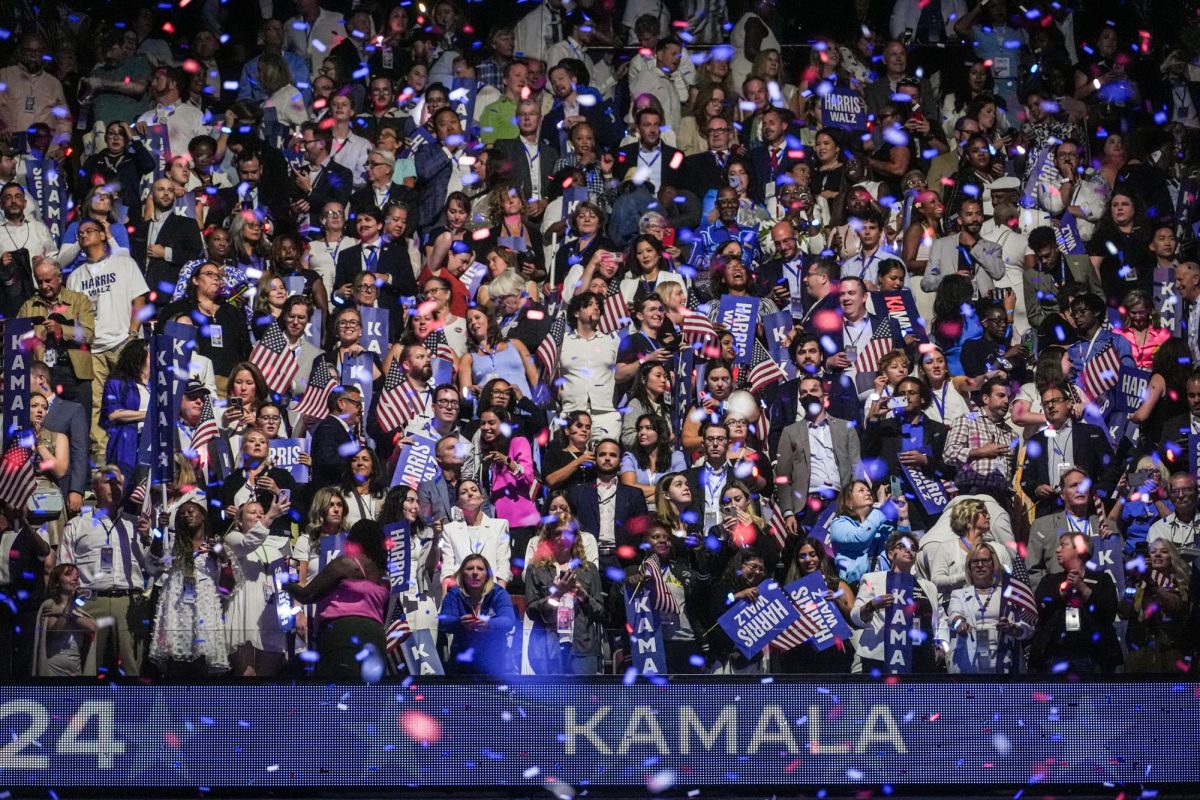 Crowd members cheer as balloons and confetti fall from the ceiling of the United Center during the last night of the Democratic National Convention in Chicago on Thursday, Aug. 22, 2024. 