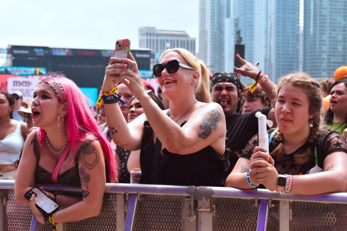 
Militarie Gun fans sing along to the bands performance at the IHG Hotels & Resorts stage on Friday, Aug. 2, 2024. People dance, jump, scream and sing together as the band plays their popular hits.