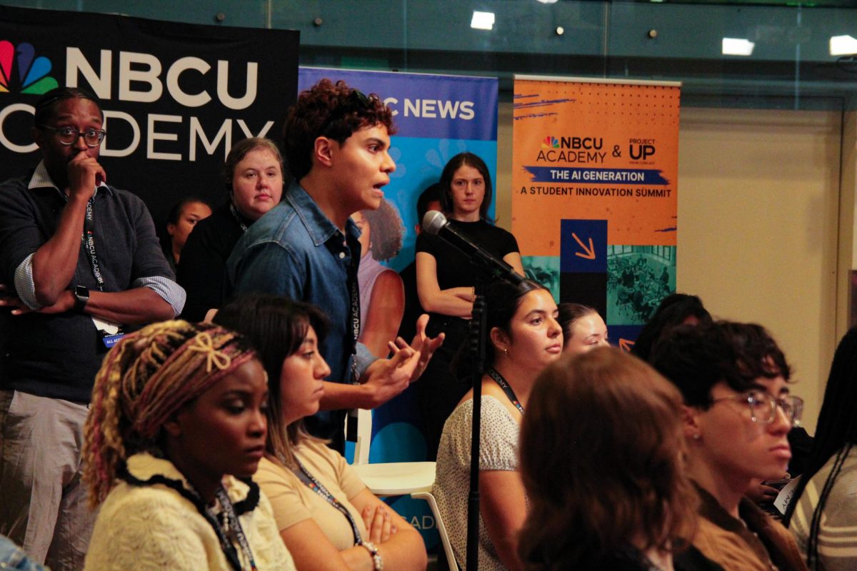 A sophomore business major at DePaul University, Roswen Rene, asks about AI policies during the NBCU Academy AI summit held in the Conaway Center at 1104 S. Wabash Ave on Wednesday, Sept. 25, 2024.