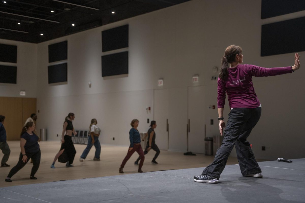 BeMoved dance instructor Jennifer Edgcomb leads students in cultural dance during the "Dance for Democracy" event on the fifth floor of the Student Center on Wednesday, Oct. 16, 2024. 