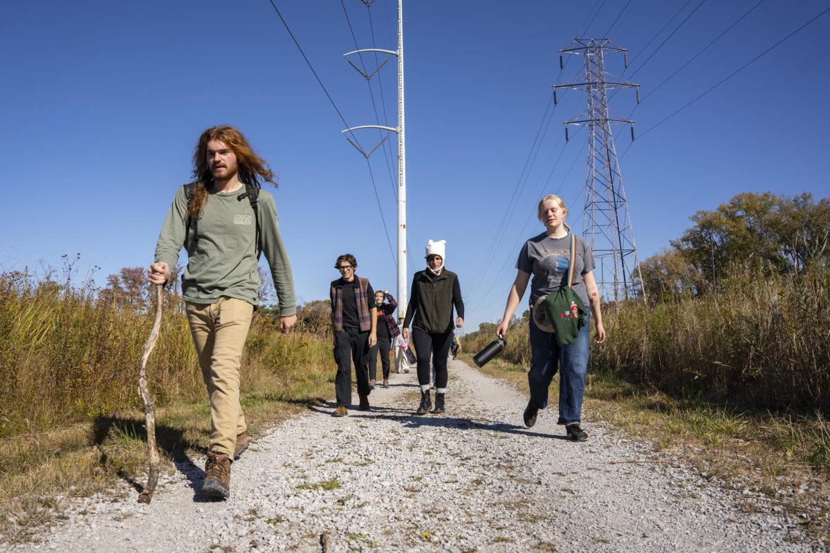 Renegades Outdoor Collective members walk down a hiking trail during their trip to the Indiana Dunes National Park on Saturday, Oct. 19, 2024.