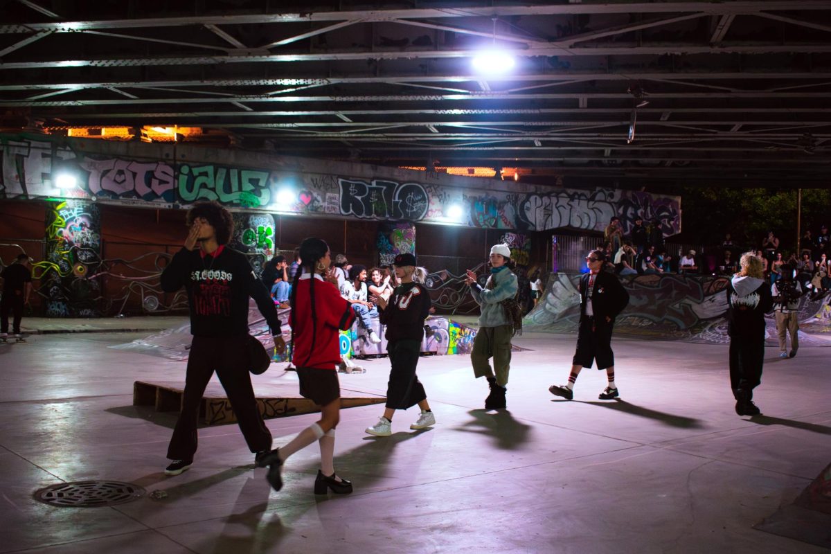 Lawless Fashion and Dollhouse collab on Saturday, Oct. 5, 2024, for the fashion show and skate park jam at Logan Skatepark. Fashion models walk in a line and clap as they do their last walk down for the night. 