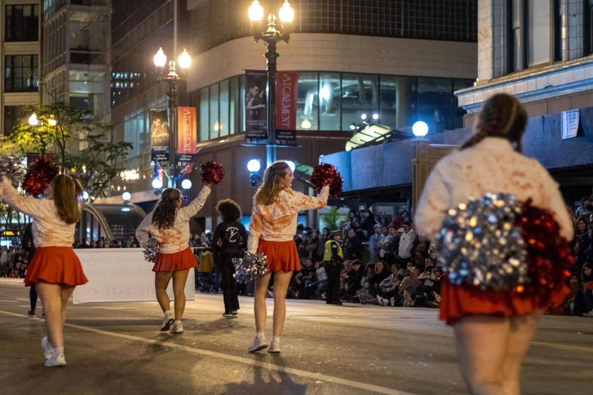 The Columbia Renegades Dance Team march in the "Arts in the Dark" parade down State Street on Saturday, Oct. 19, 2024. 