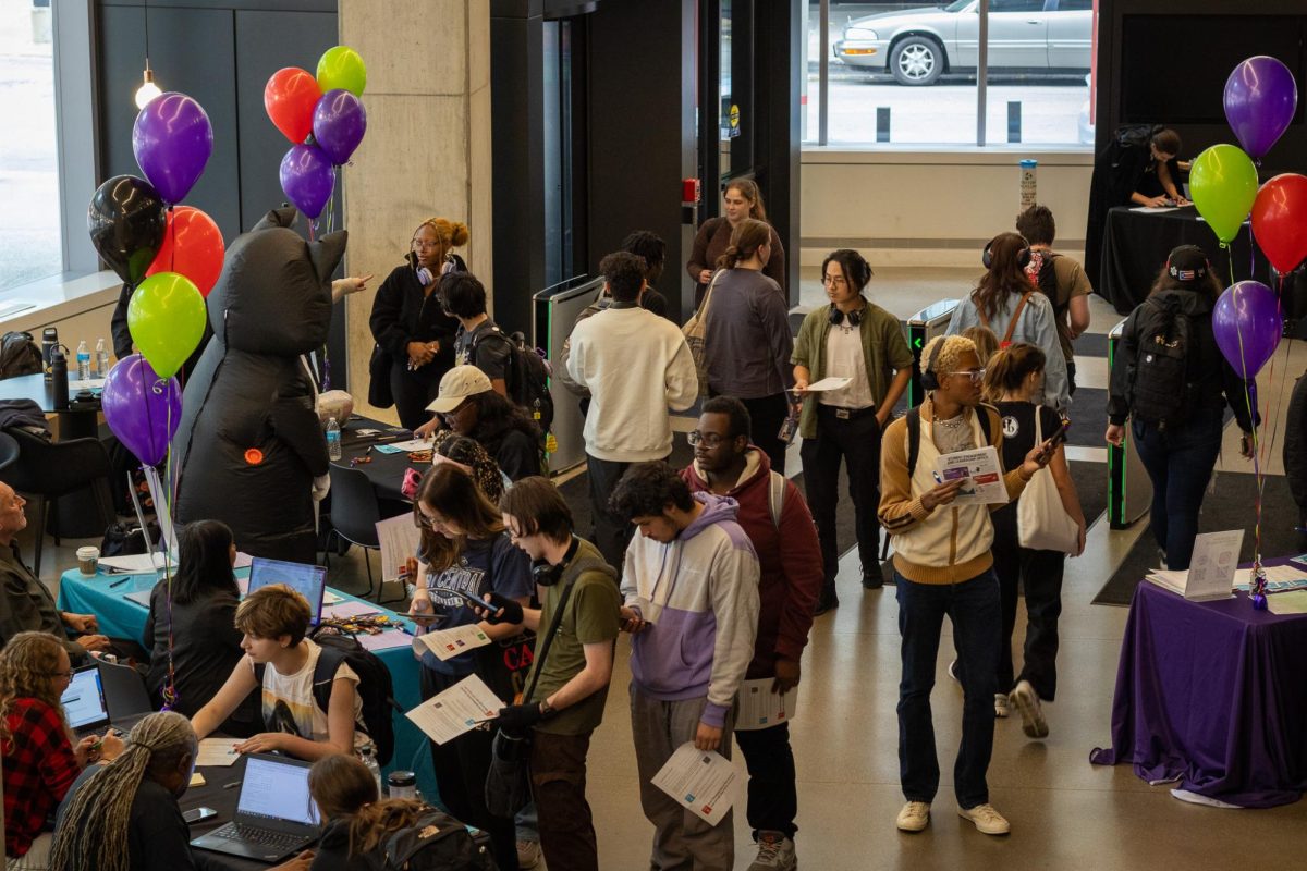 Students visit different tables during RegFest at the Student Center on Tuesday, Oct. 22, 2024.