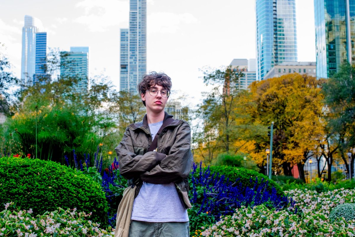 Callum Meyer, a sophomore illustration major at Columbia College, poses for a photo in Grant Park on Wednesday, Oct. 23, 2024.