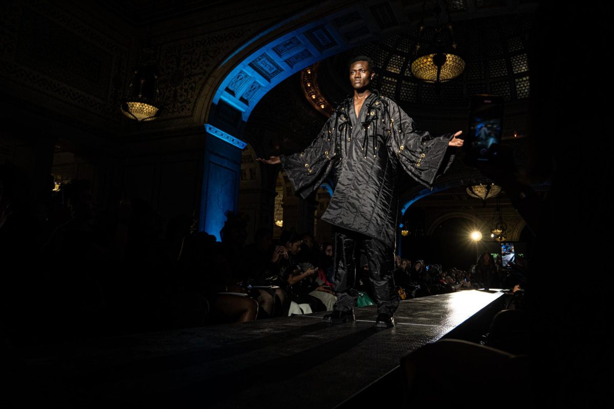 A model wears Justin Dougan-LeBlanc's collection on the runway during the first official show of Chicago Fashion Week inside of the Chicago Cultural Center on Wednesday, Oct. 9, 2024.