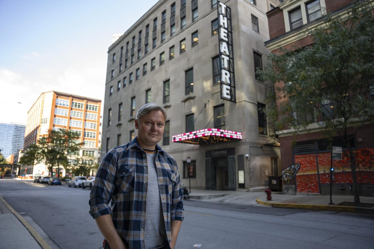 Grant Sabin, a part-time instructor in the School of Theatre and Dance, poses for a photo outside the Theater Building on Wednesday, Oct. 16, 2024. He won a Jeff Award for "Scenic Design- Midsize" for his work on the play “Turret” at the Red Orchid Theatre.