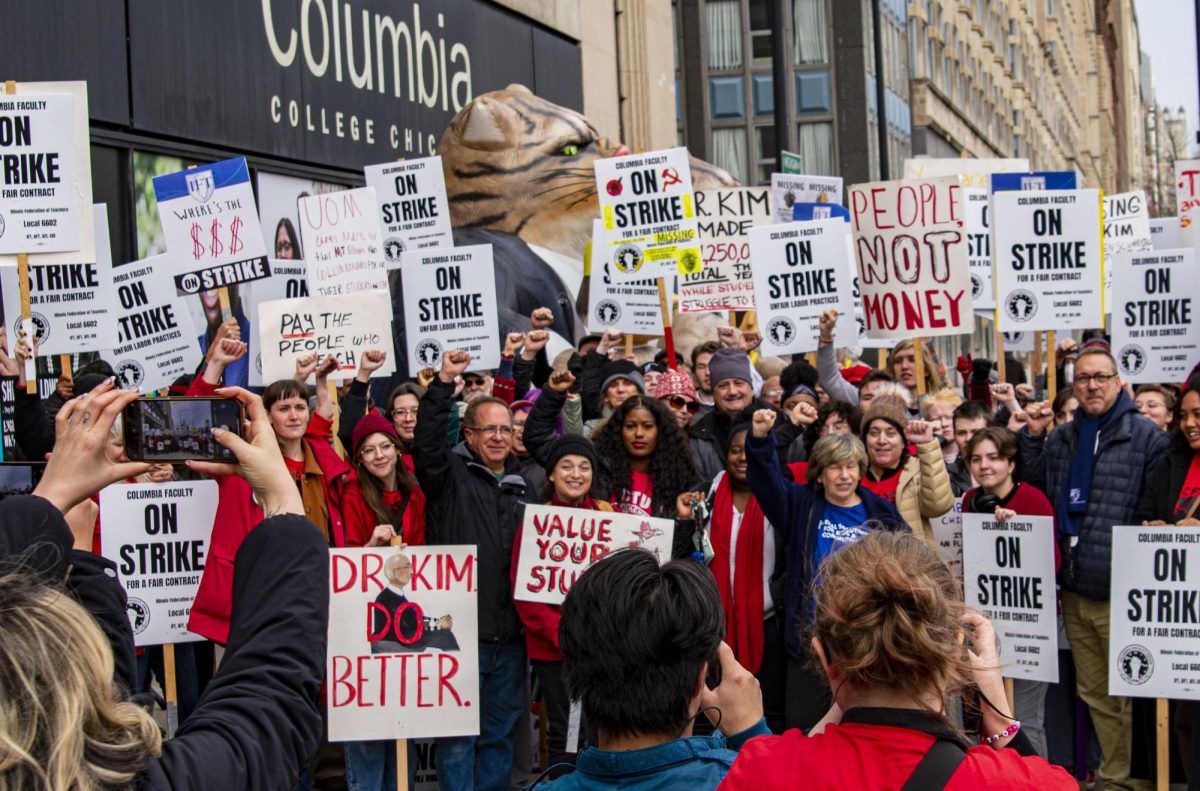 Outside 600 S. Michigan, union leaders, guest speakers and supporters of CFAC pose for a large group photo on Friday, Nov. 3, 2023.