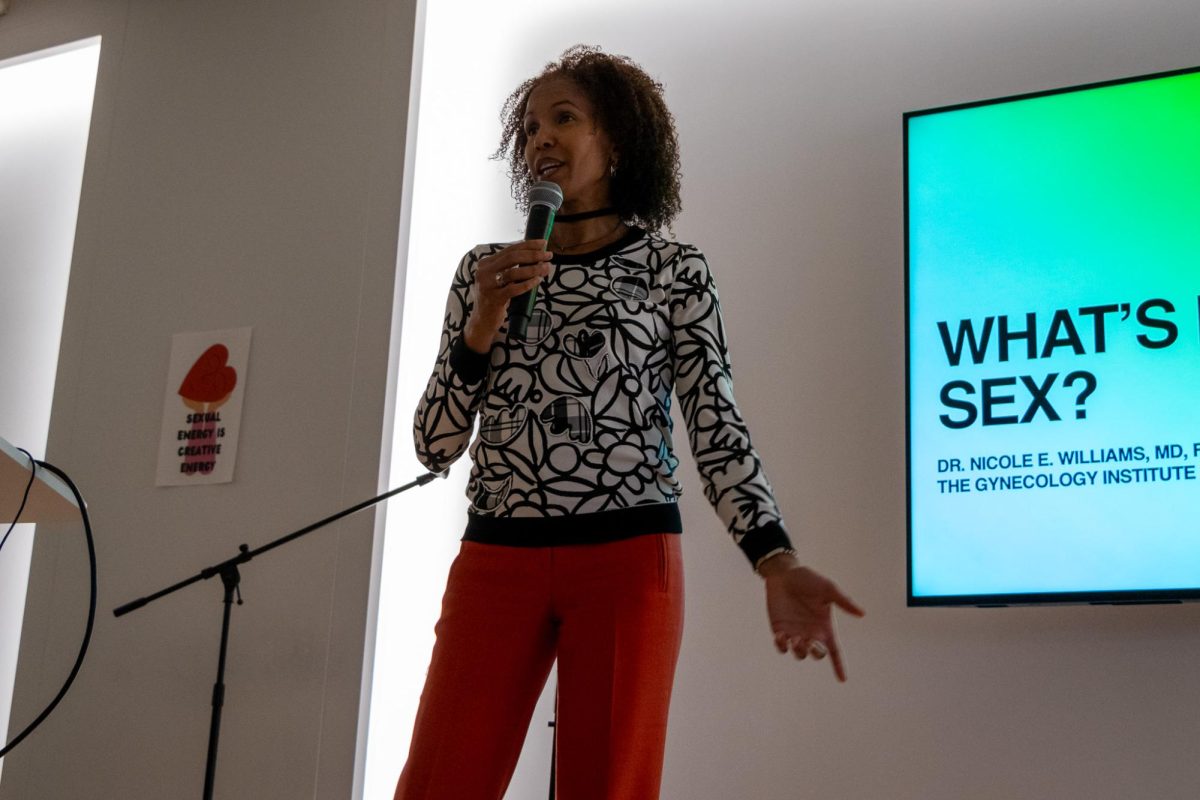 Dr. Nicole Williams, a licensed gynecologist, speaks at the "Are you coming?" sexual health event located at the Hive in the 618 S. Michigan Ave. building on Oct. 11, 2024.