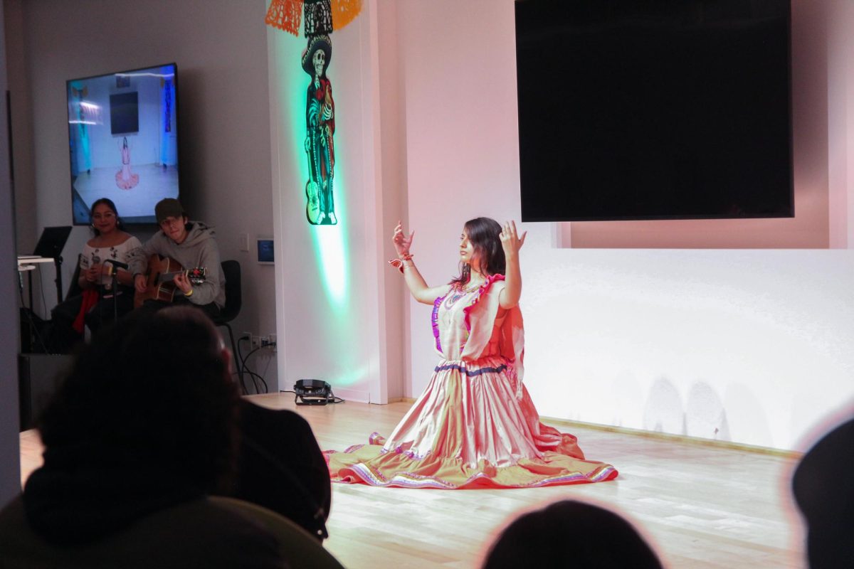 Sophmore student, Paola Escudero, performing a dance during the day of the dead event hosted by the Student Diversity and Inclusion office on the 3rd floor of 618 S. Michigan Ave. on Friday, Nov. 1st, 2024.