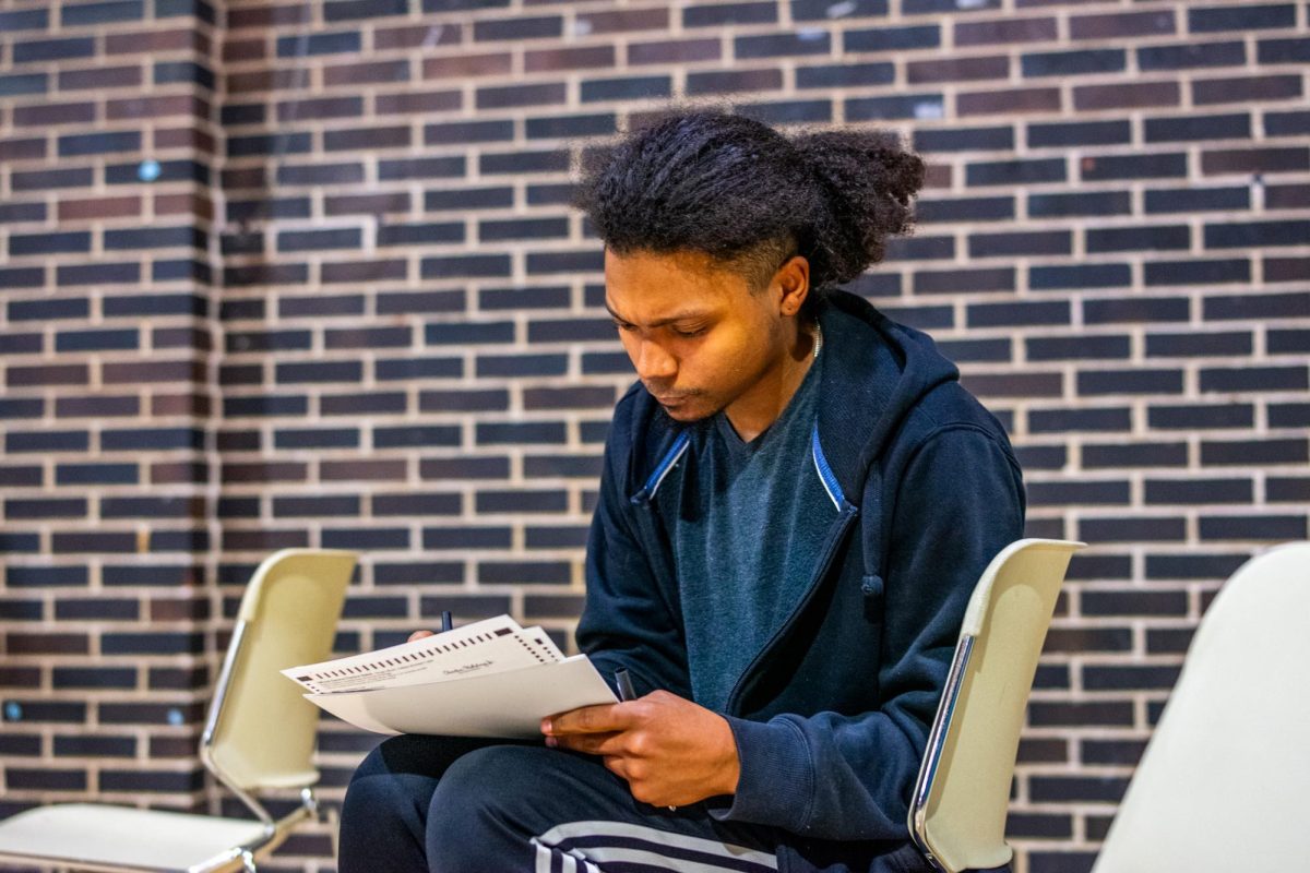 A young voter fills out his ballot at Irvin C. Mollison Elementary School, 4415 S. King Drive in Bronzeville, on Tuesday, Nov. 5, 2024. 